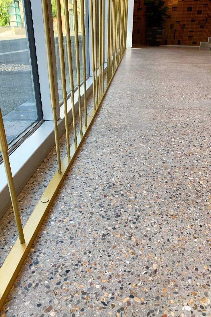 Beautiful terrazzo floor tiles design for hall with modern texture and vibrant tones – ideal for living room flooring.